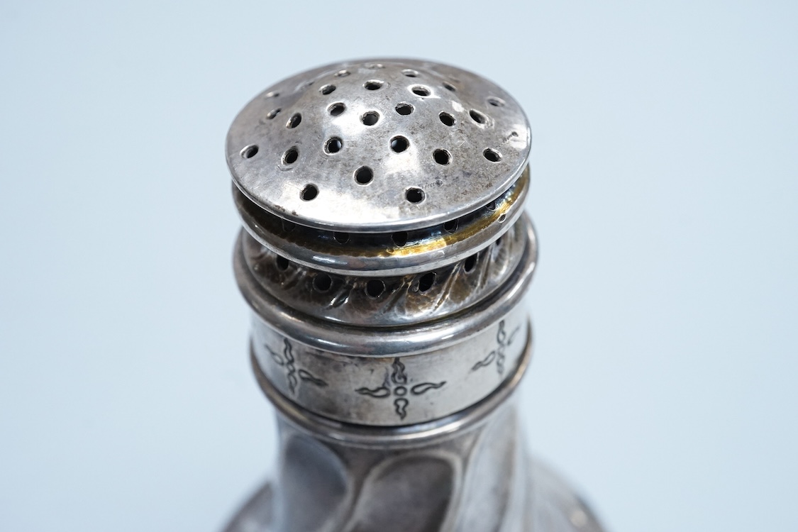 A George V Arts & Crafts silver sugar caster, by Omar Ramsden, with spiral decoration and engraved with stylised stars, London, 1931, 14.9cm, 5.3oz.